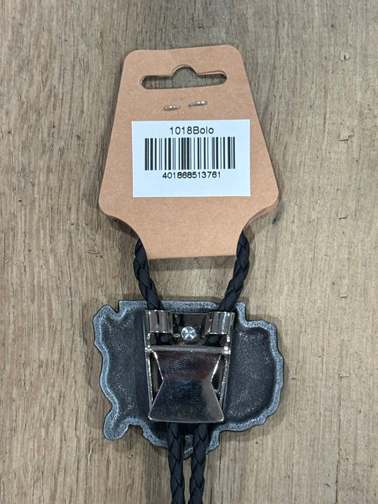 Metal clip with black cord on a cardboard backing with a barcode on a wooden surface