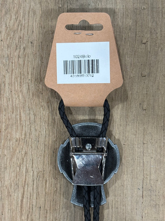 Metal clip with black cord on a cardboard backing with a barcode on a wooden surface
