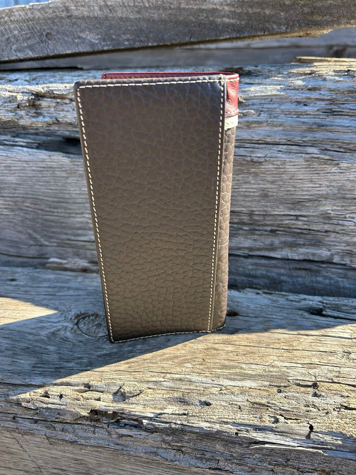 Coffee Brown leather wallet on a wooden surface