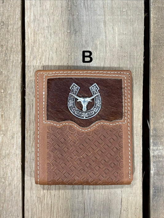 Brown leather wallet with embossed basketweave design and horseshoe and longhorn concho on a wooden surface