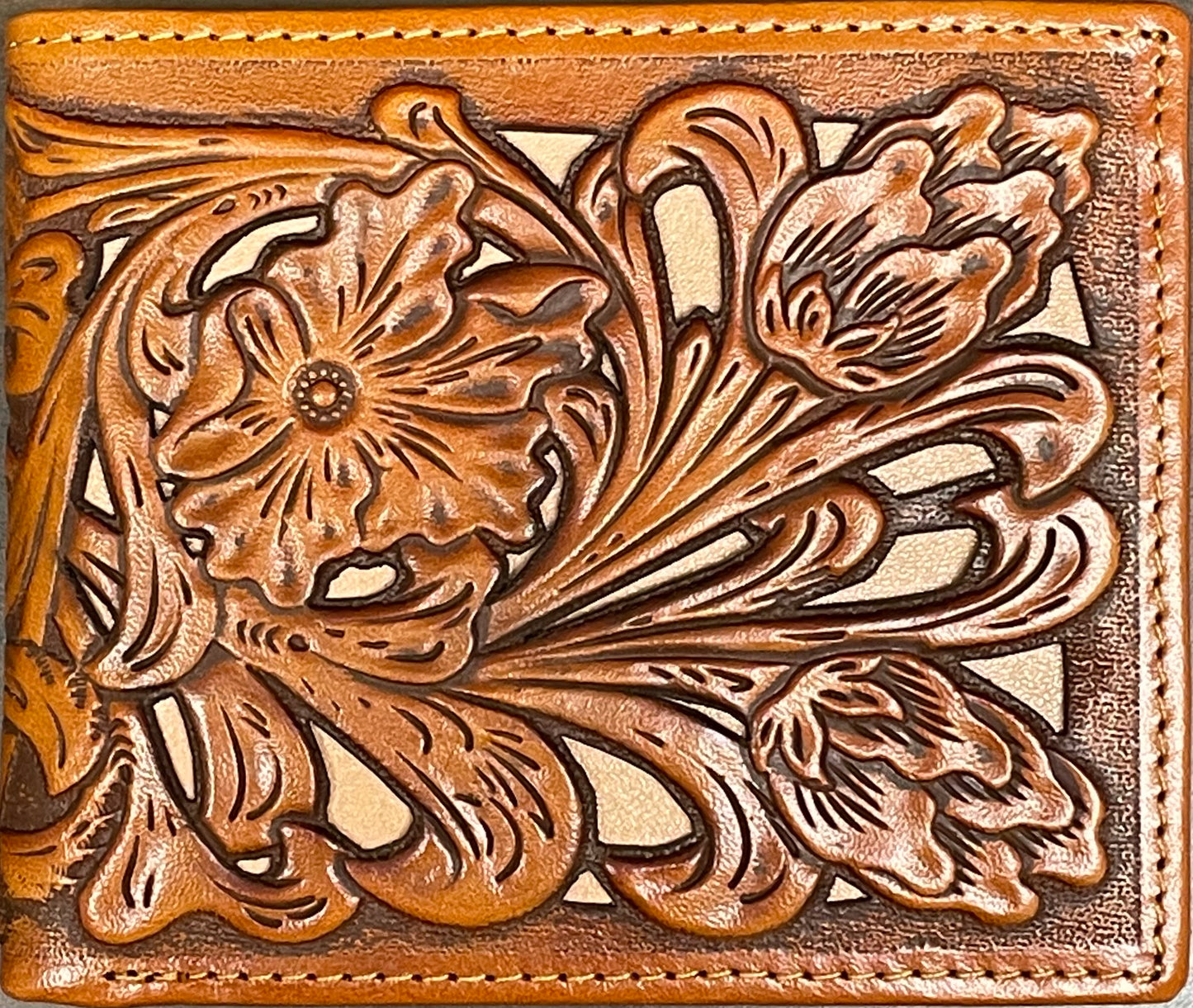 Close up of a Light Brown leather wallet with floral embossing