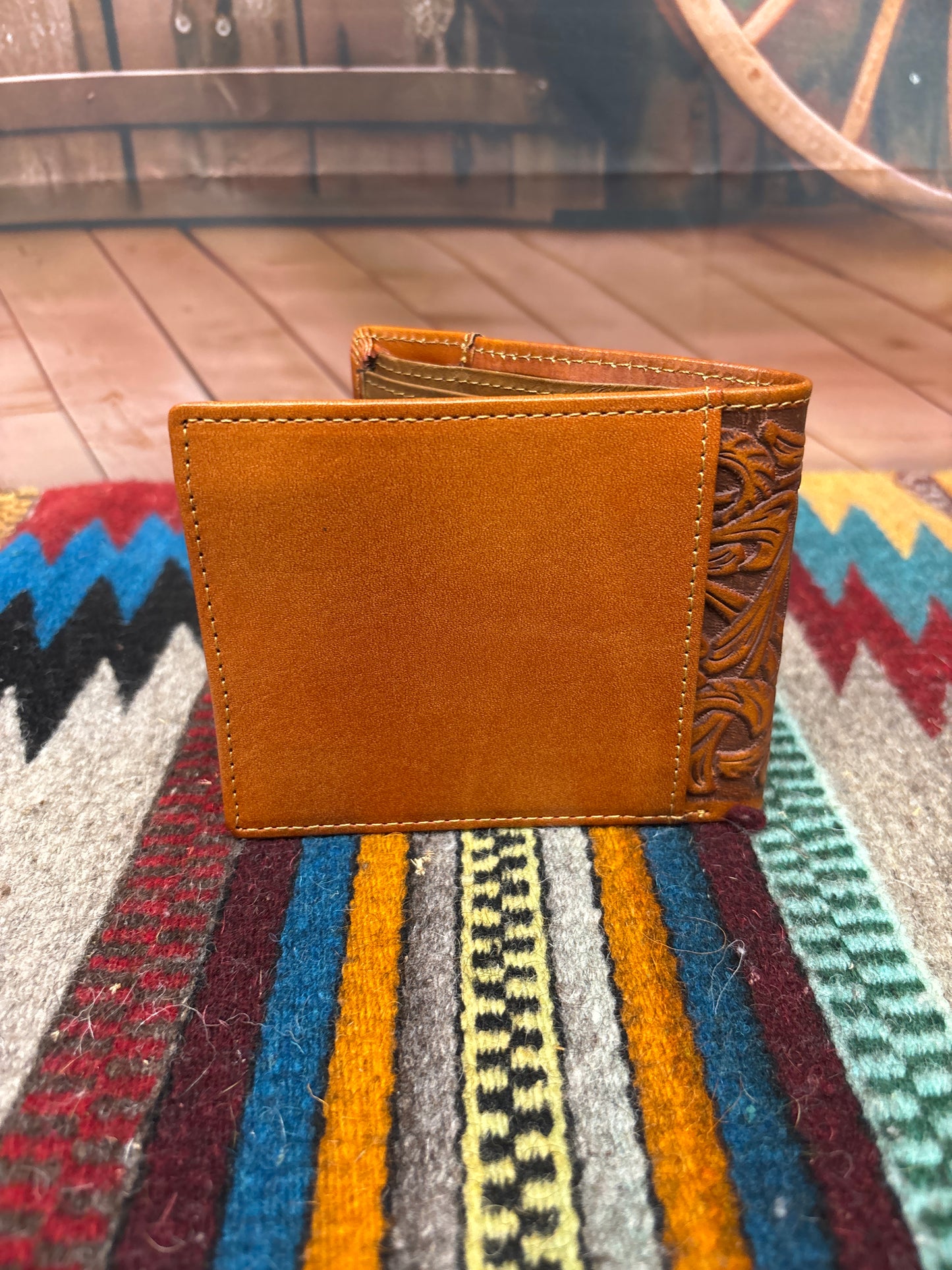 This Brown leather bifold wallet. Rear view showing a additional storage spot.