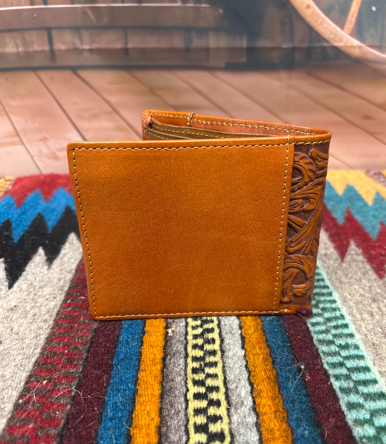 This Brown leather bifold wallet. Rear view showing a additional storage spot.