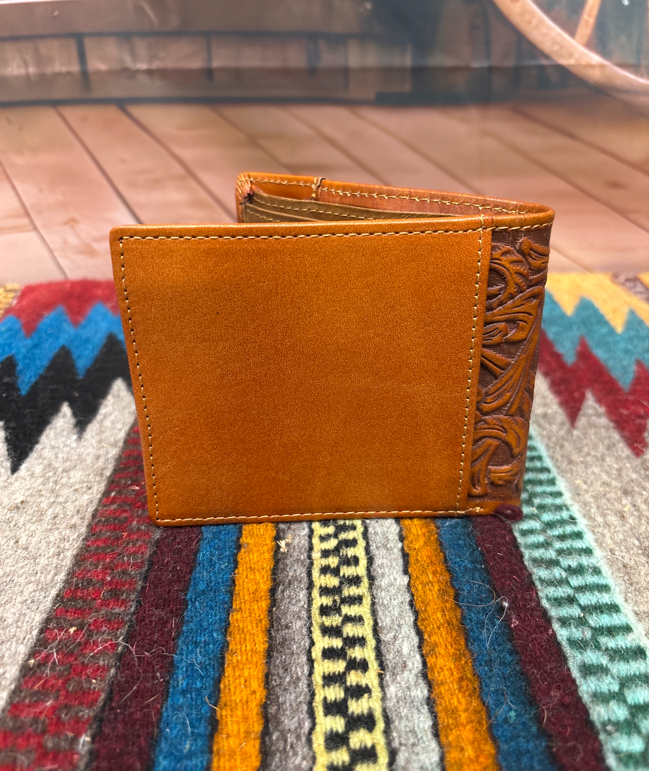 This Brown leather bifold wallet. Rear view showing a additional storage spot.