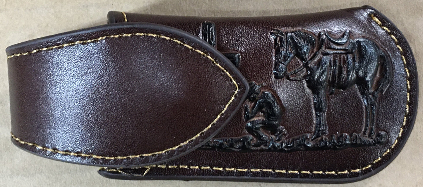 Coffee Brown leather sheath with horse design on a beige background