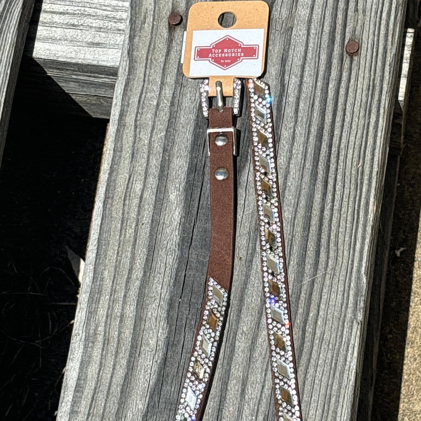 Western style hat band with Brown and Clear diamond shaped alternating crystals. Features a crystal studded buckle for a adjustable fit.