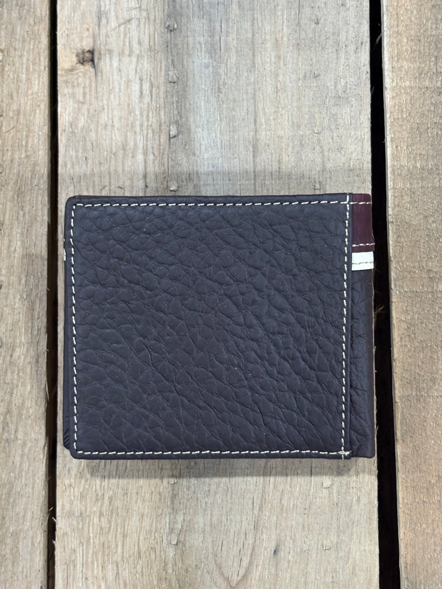 Coffee Brown leather cardholder with white stitching on a wooden surface