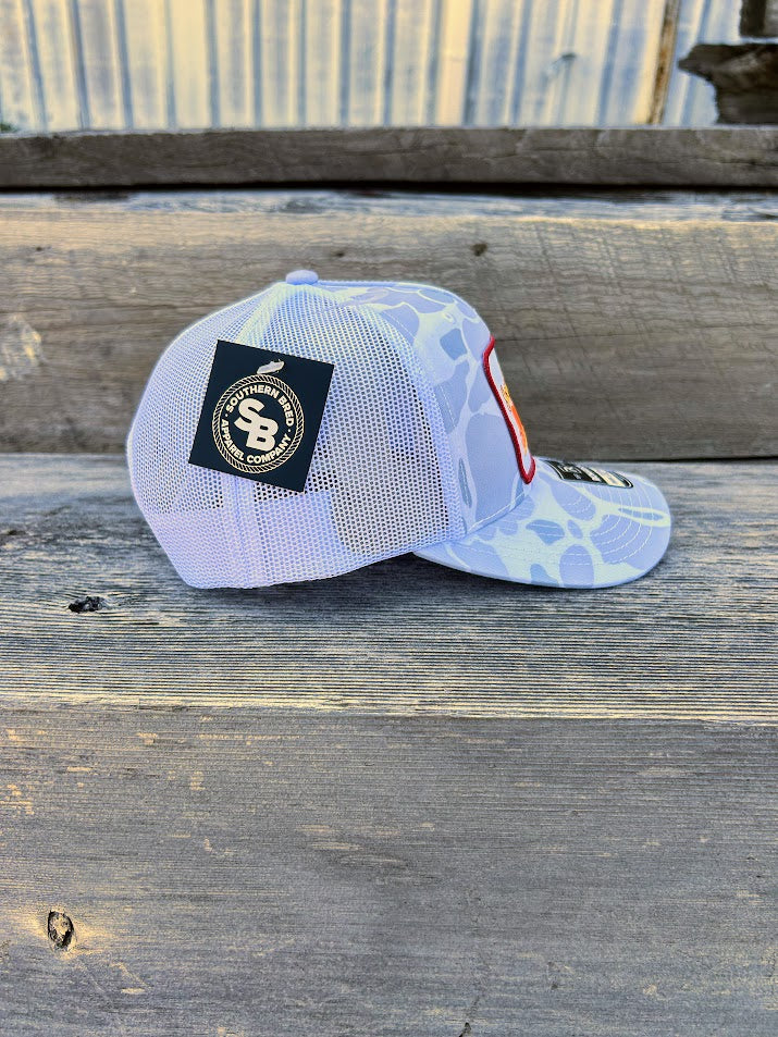 White cap with a logo on a wooden surface