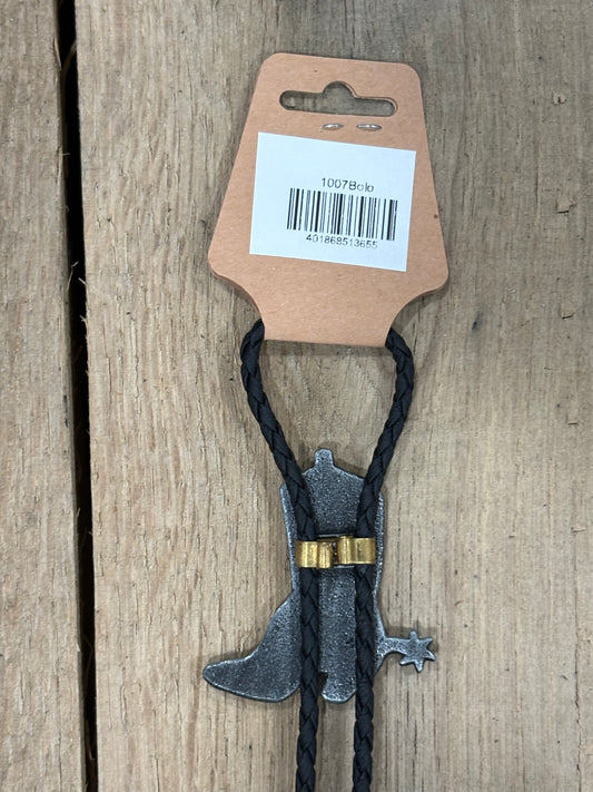 Metal clip with black cord on a cardboard backing with a barcode on a wooden surface