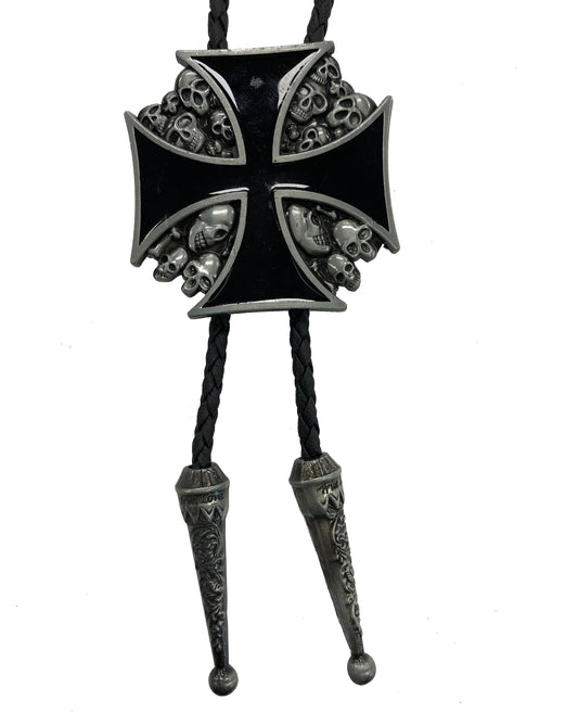 Black and silver cross pendant with skull designs on a white background