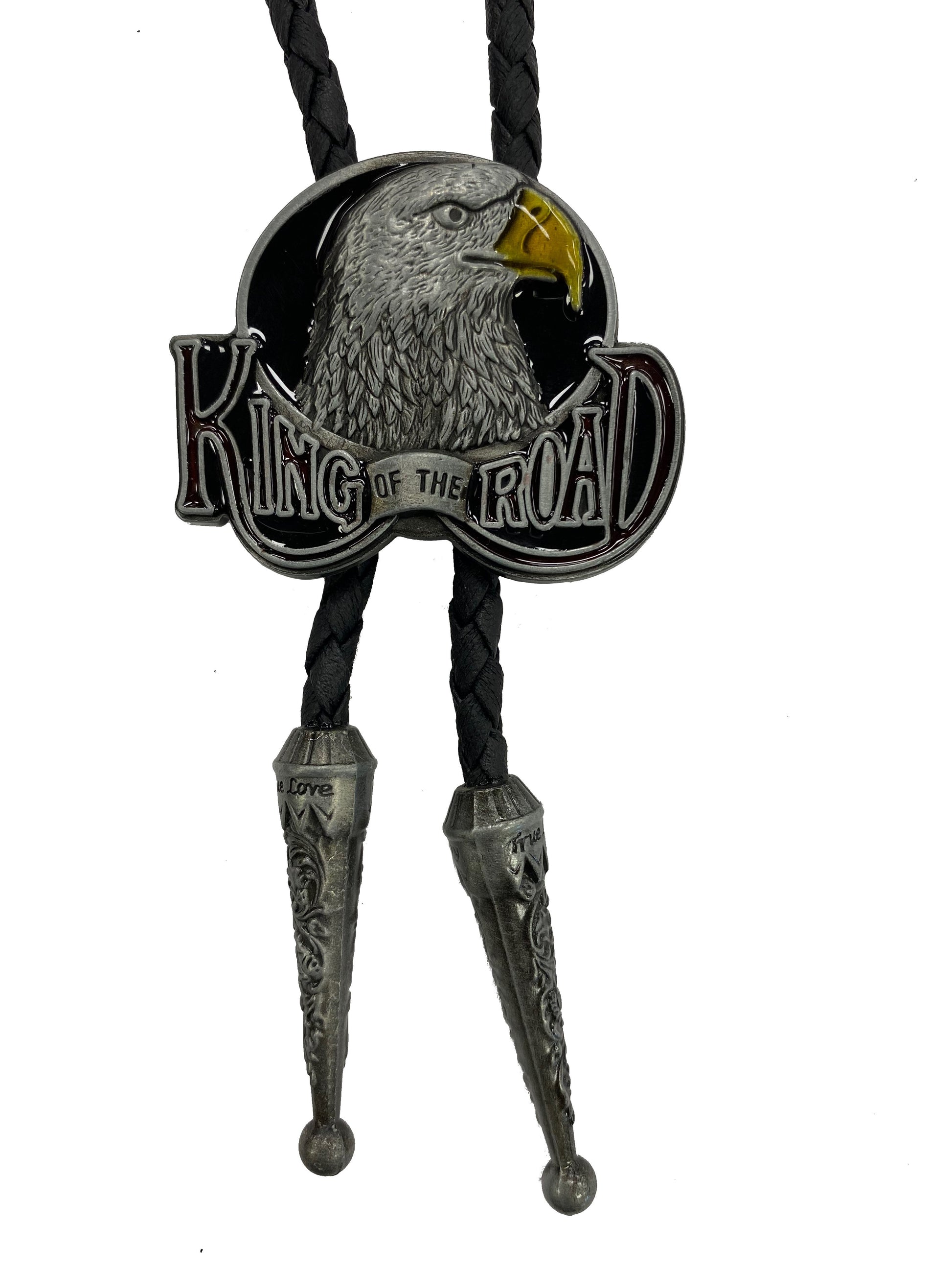 Bolo tie with an eagle design and 'King of the Road' text on a white background
