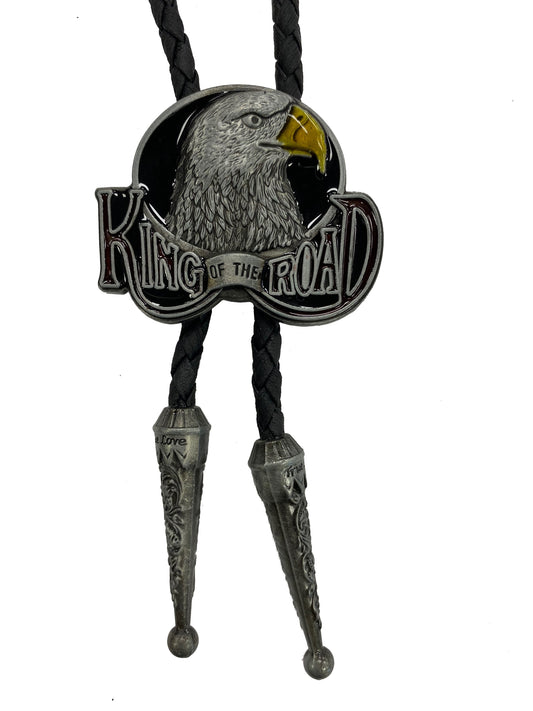 Bolo tie with an eagle design and 'King of the Road' text on a white background