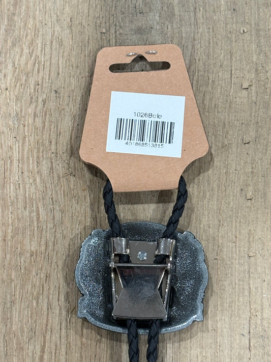 Metal clip with black cord on a cardboard backing with a barcode on a wooden surface