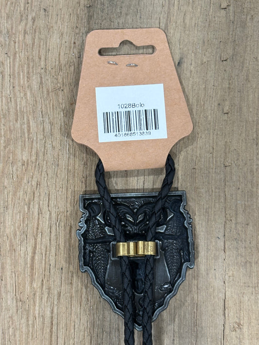 Metal clip with black cord on a cardboard backing with a barcode on a wooden surface