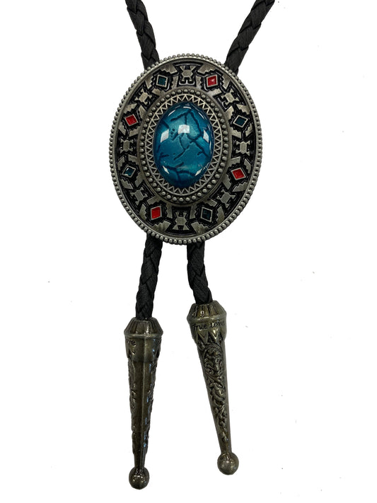 Bolo tie with decorative metalwork and blue stone on a white background