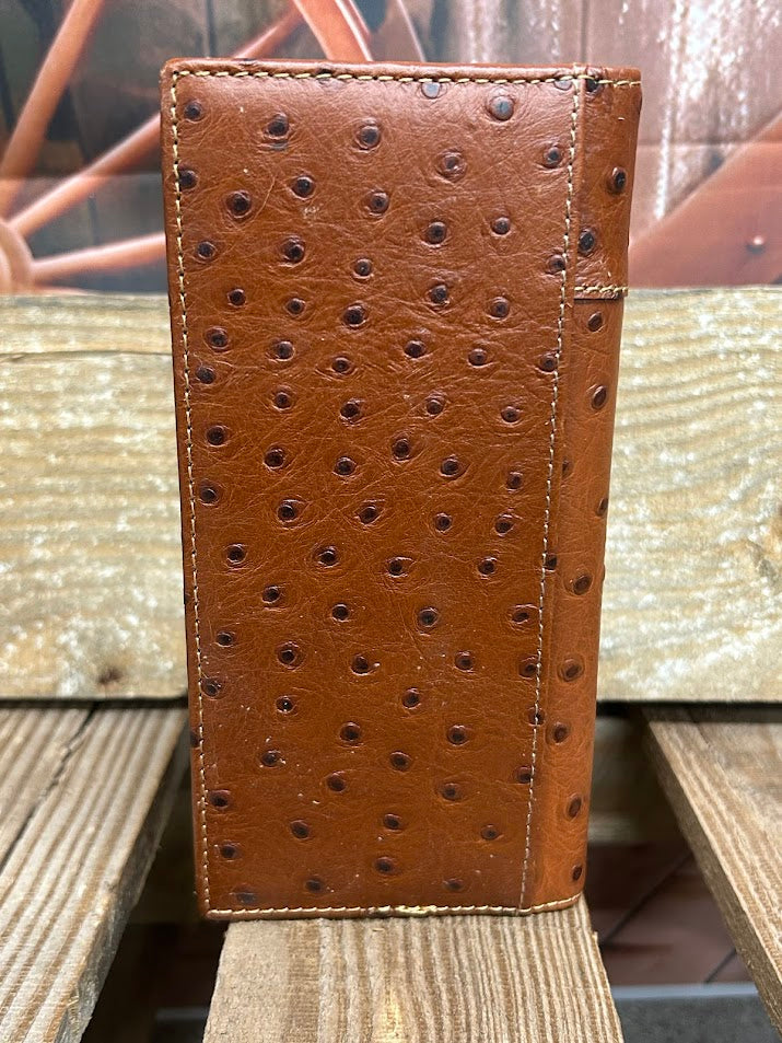 Brown textured wallet on a wooden surface