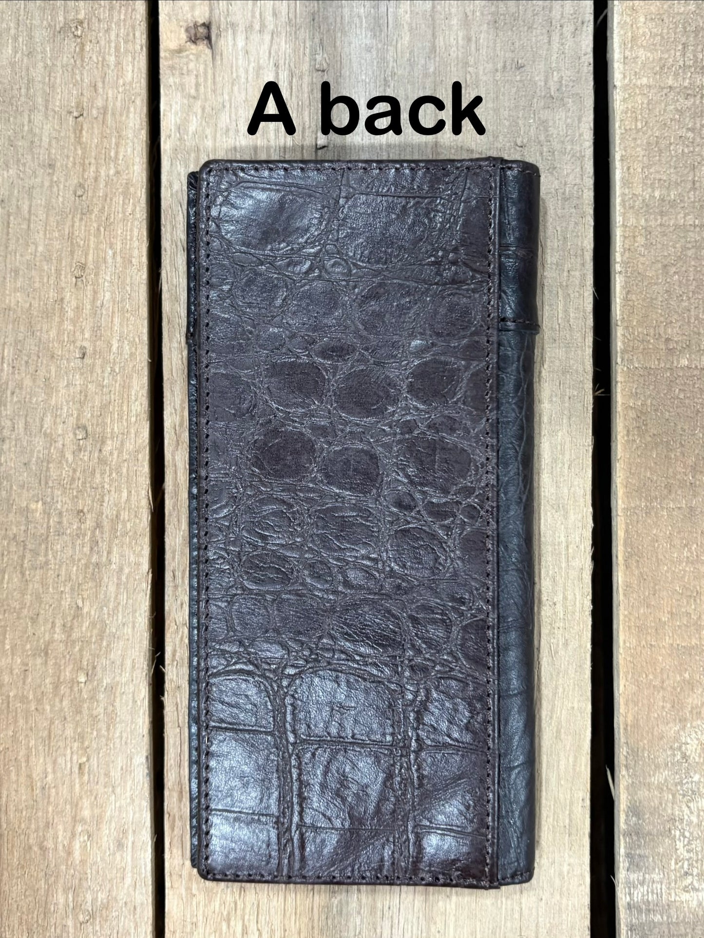 Coffee Brown leather wallet on a wooden surface with 'A back' text. Back View