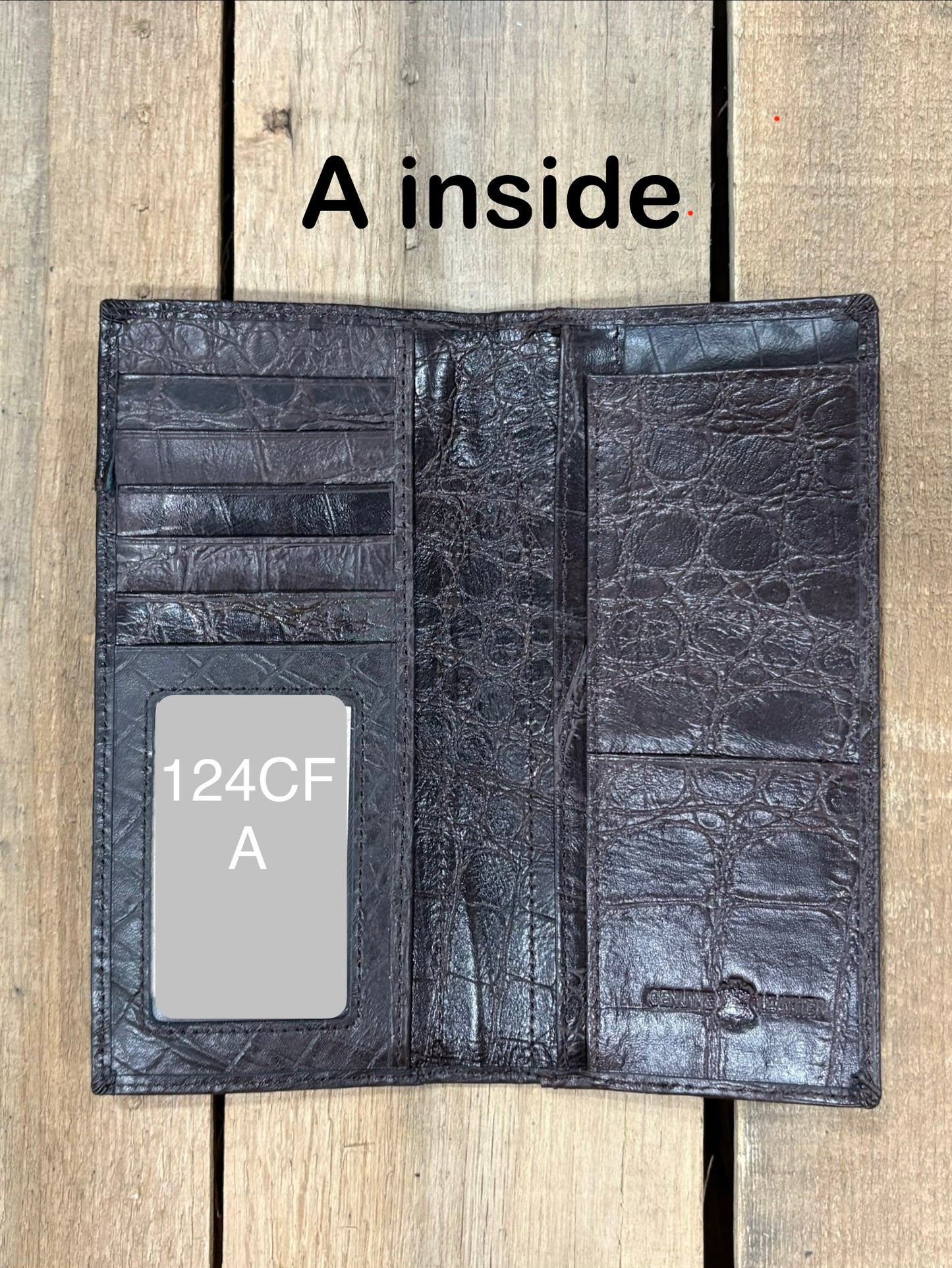 Open Coffee Brown leather wallet on a wooden surface with 'A inside' text.