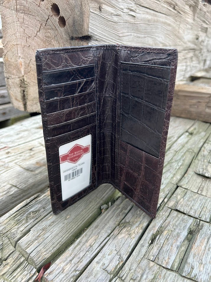 Coffee Brown leather wallet with a visible brand label on a wooden surface