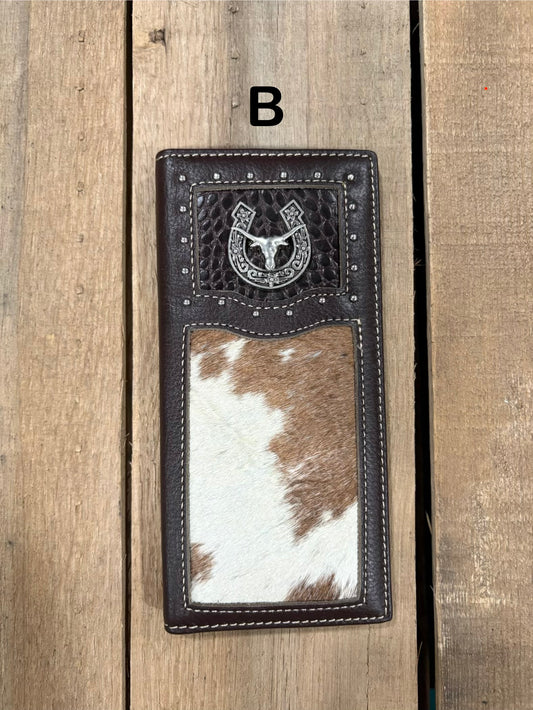 Coffee brown leather wallet with horseshoe and longhorn concho design on a wooden surface