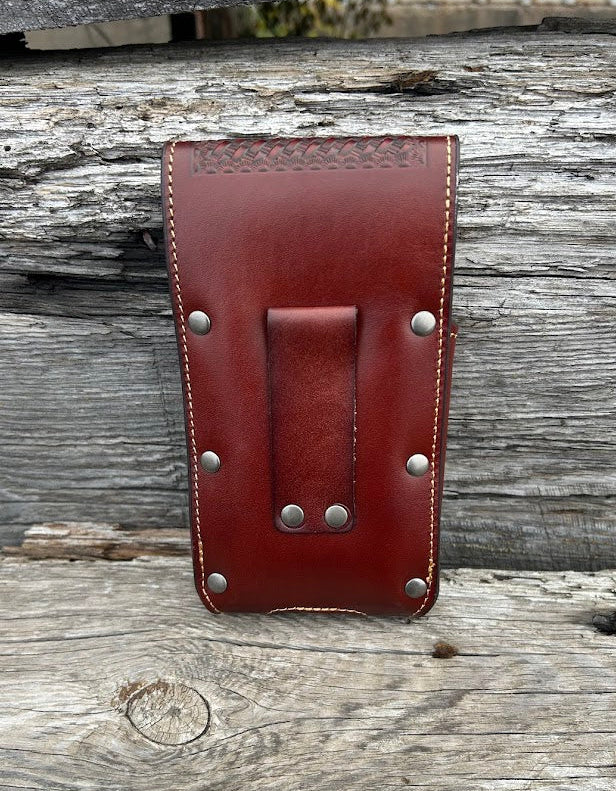 Brown embossed leather phone case with a Bull Rider Concho, has leather belt loop attachment. Rear view showing belt loop attachment that measures 3 1/4 inches high.
