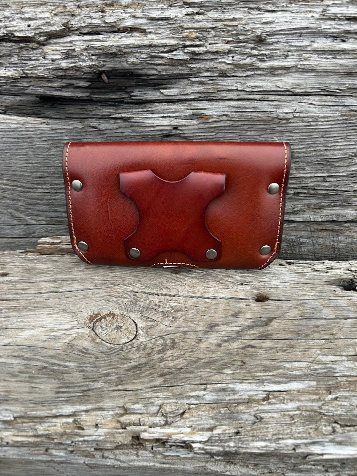 Brown Leather phone case with Texas Star Concho, attaches with a leather belt loop that measures 2 3/4 inches high. Rear view