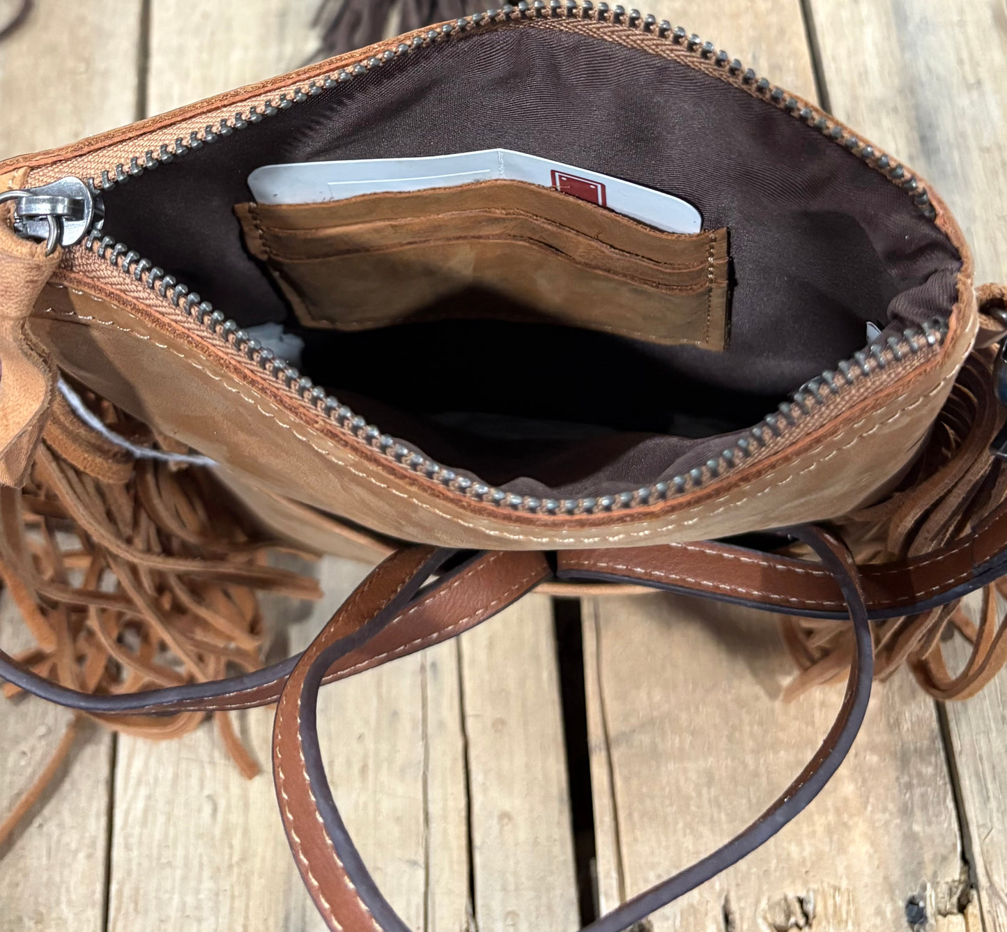 Card slot view of a brown hairon crossbody purse
