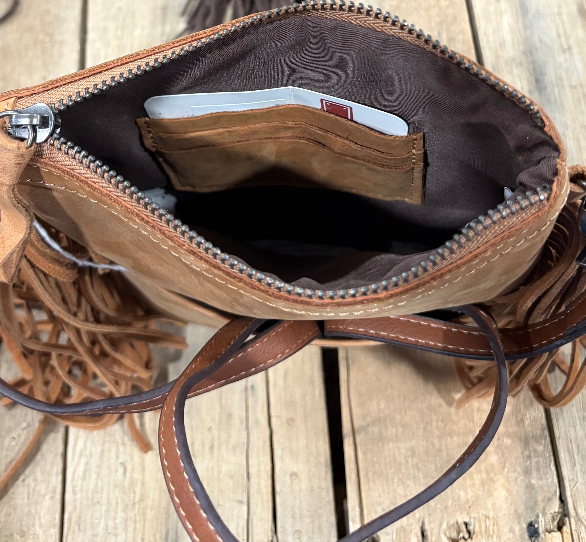 Card slot view of a brown hairon crossbody purse