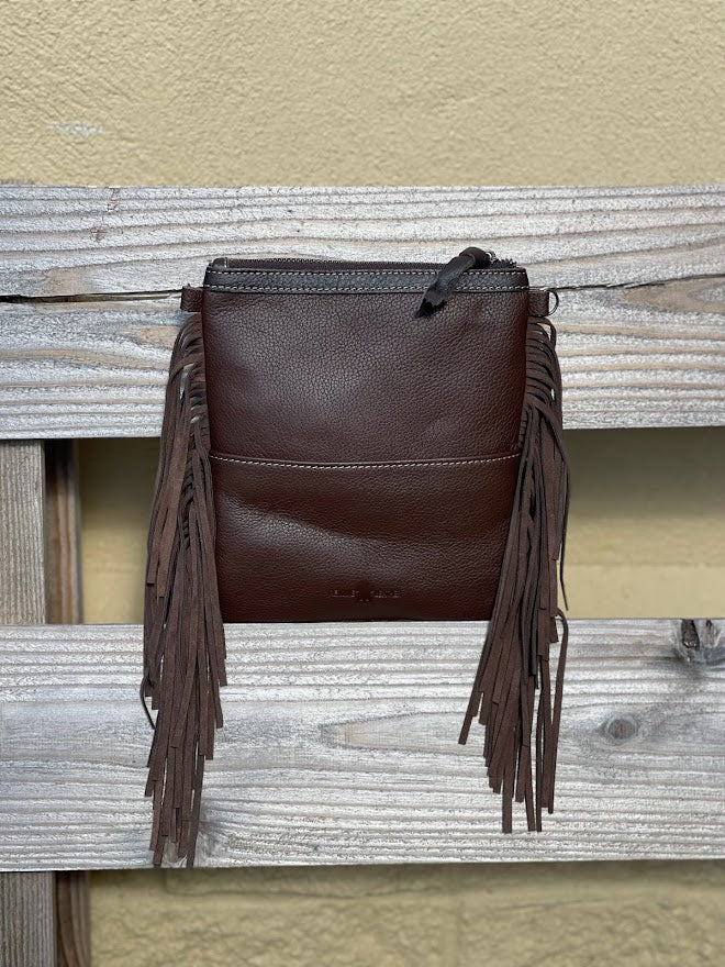 This Coffee Brown tooled leather and cowhide bag has side fringe. Back View