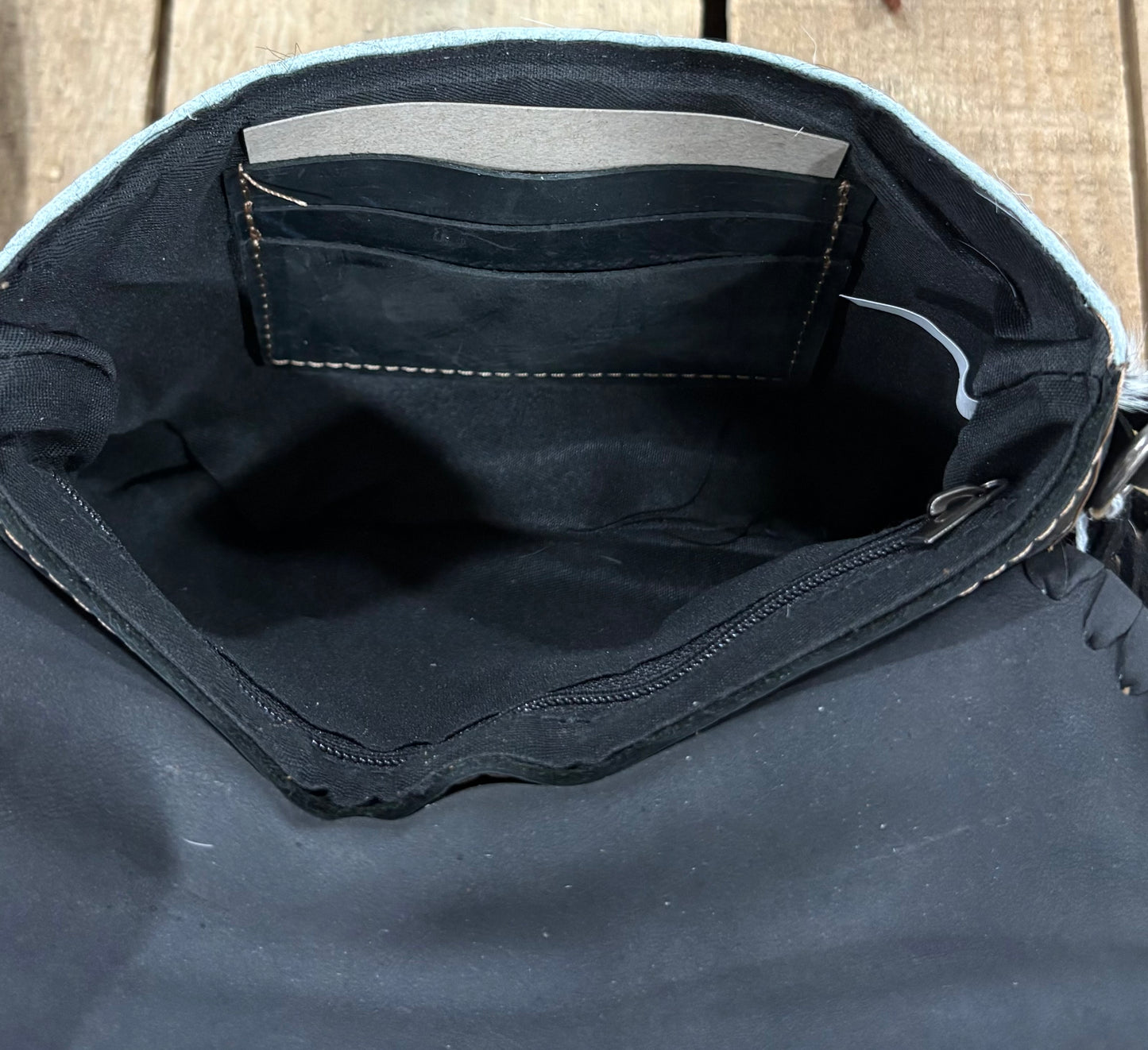 Card slot view of a black harion crossbody purse