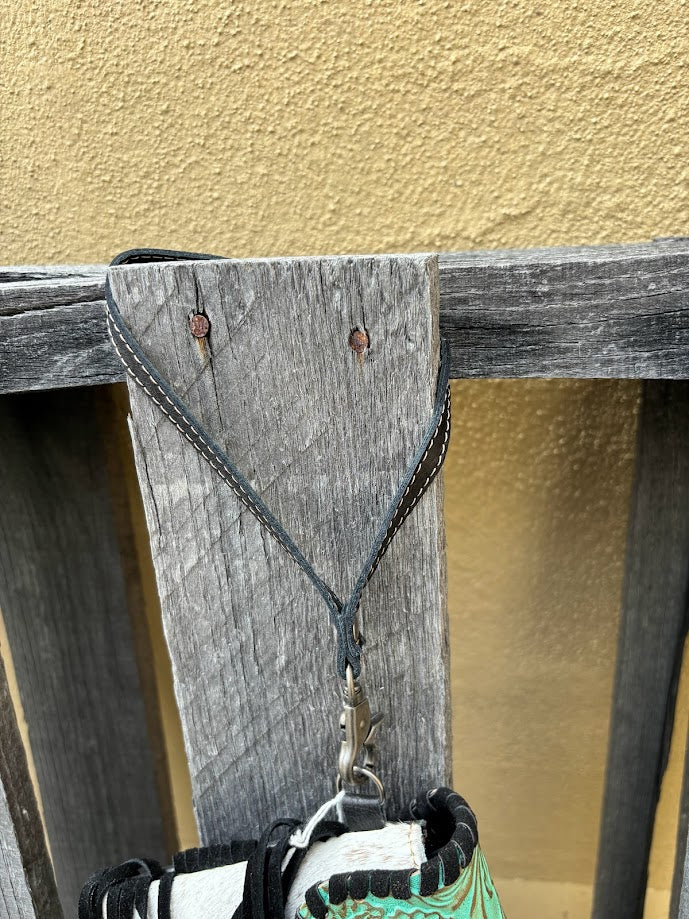 Black Wristlet that has a clasp on side of bag