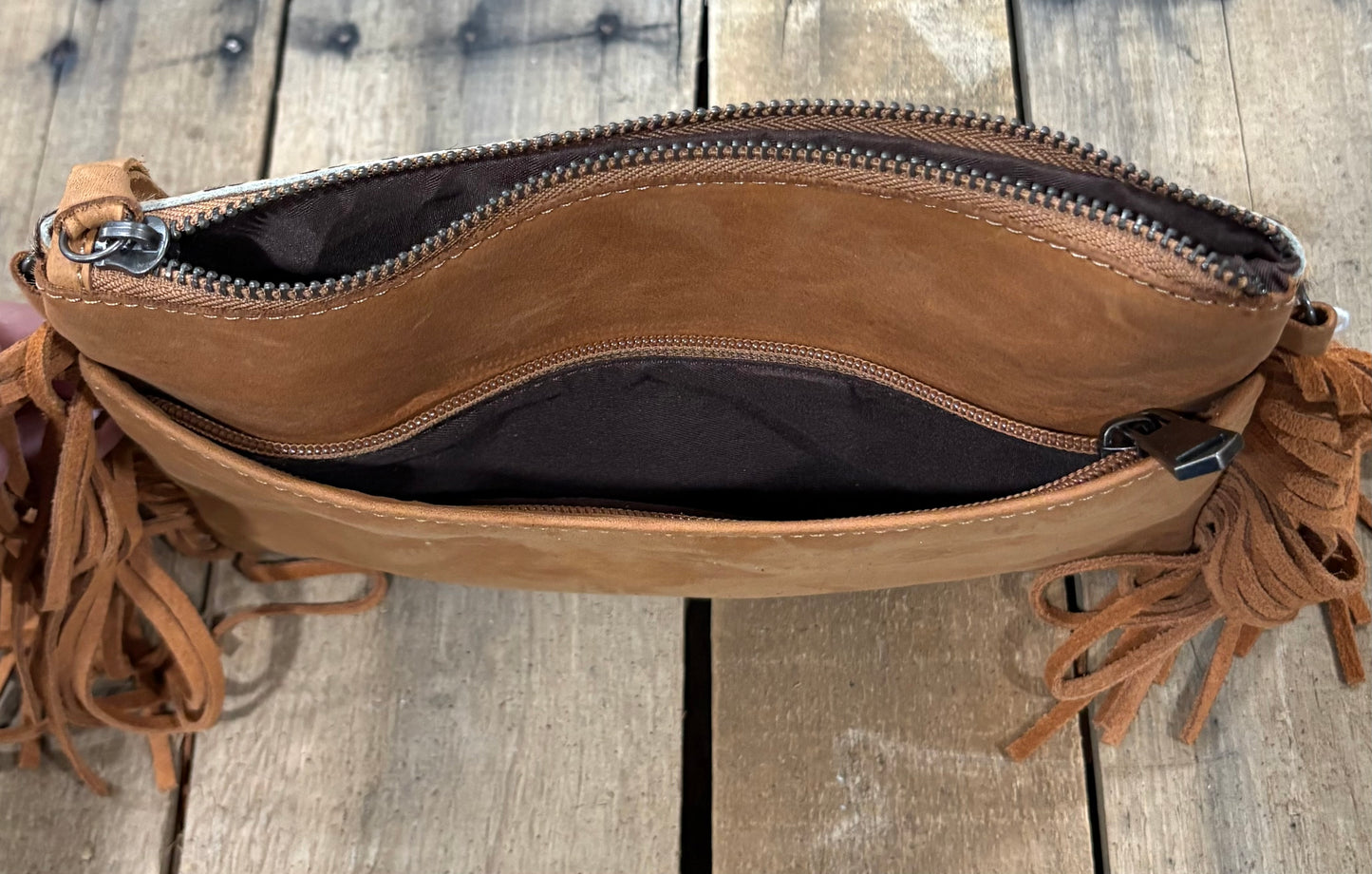 Inside view of back zipper on a wooden background