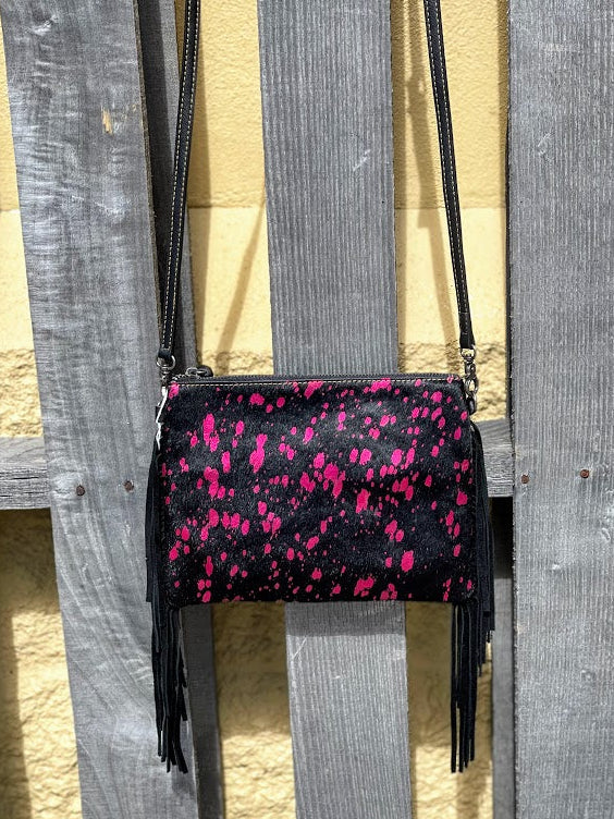 This Pink and Black cowhide leather fringe back has a adjustable shoulder strap.  Close up front view.