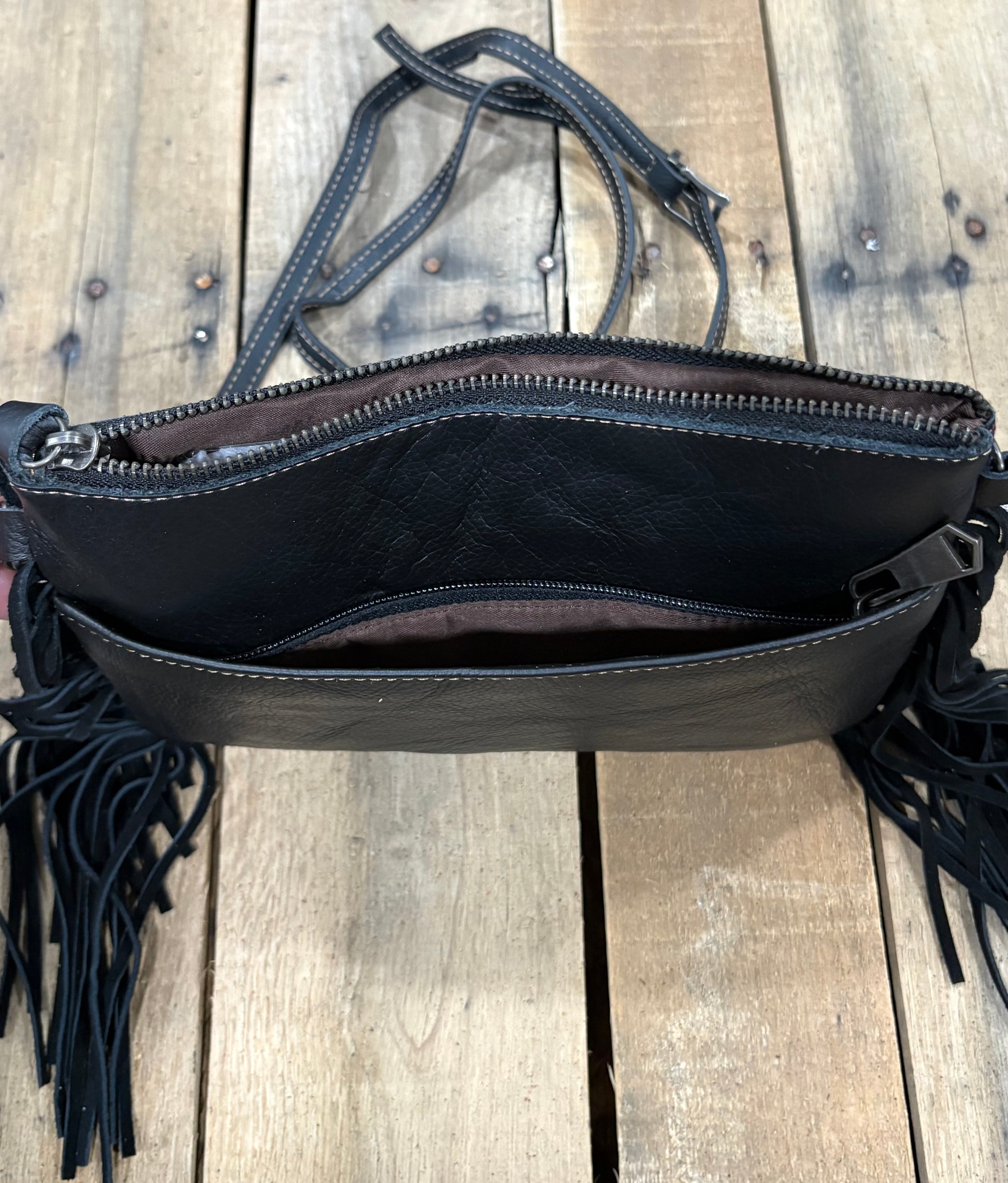Inside view of back zipper on a wooden background