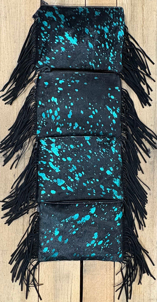 Four purse view of Turquoise and black hairon crossbodys on a wooden background