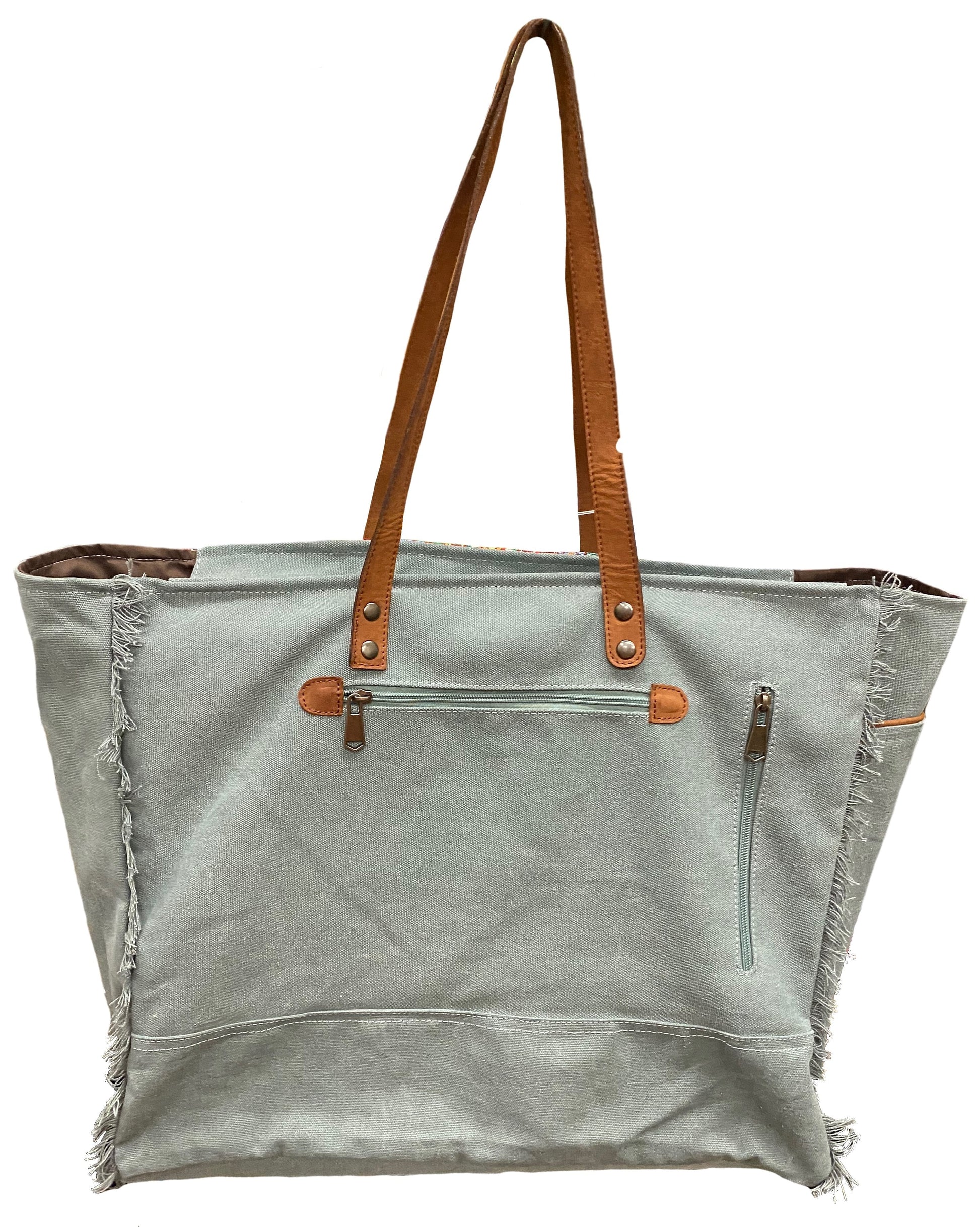 Gray tote bag with brown leather straps and trim on a white background
