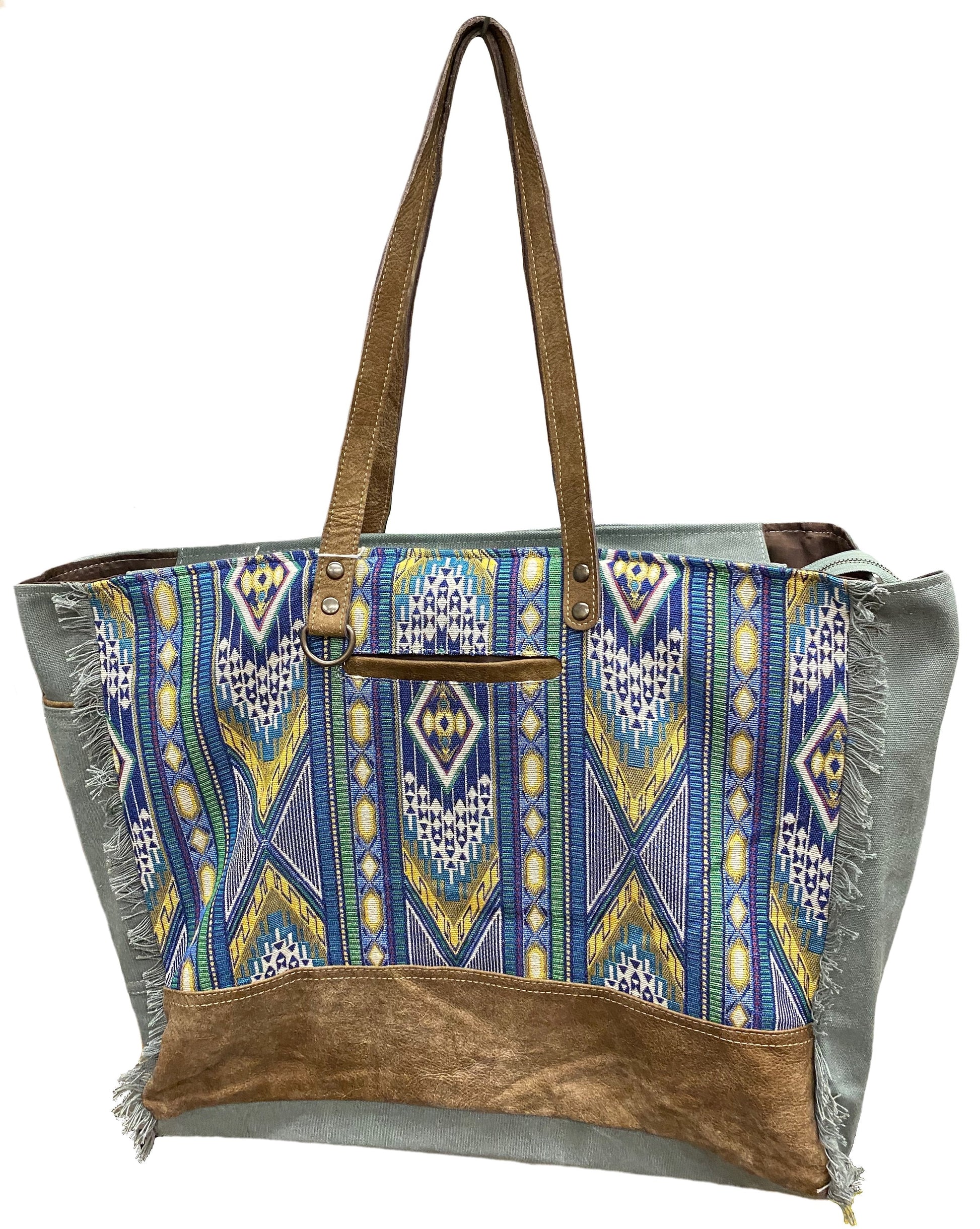 A blue multi canvas and leather conceal carry weekender bag with a geometric pattern. Front View
