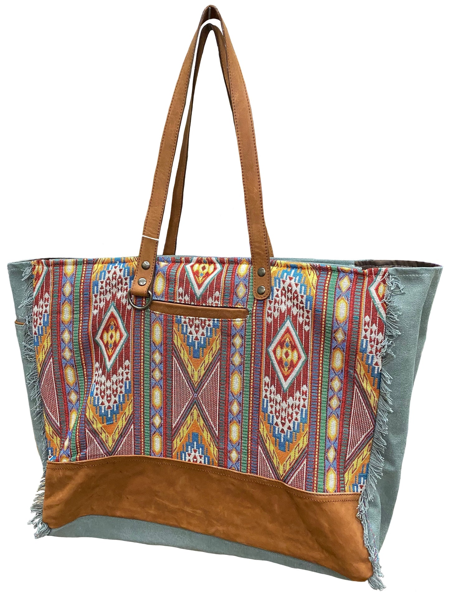 Tote bag with tribal pattern and brown leather accents on a white background