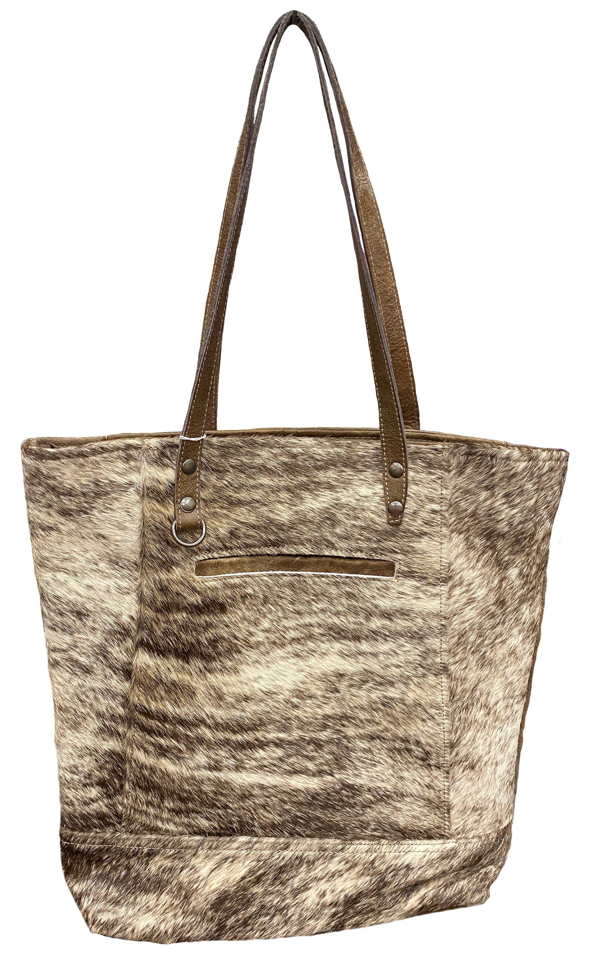 Tote bag with cowhide pattern and brown leather handle on a white background