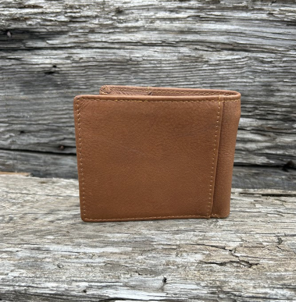 This Brown leather bifold wallet features a cowhide inlay with a Shotgun Shell Concho. Rear View