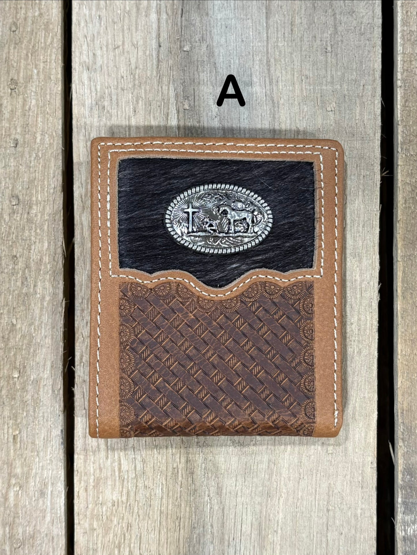 This Brown basketweave leather bifold wallet features a cowhide inlay with a Praying Cowboy Concho. Front View