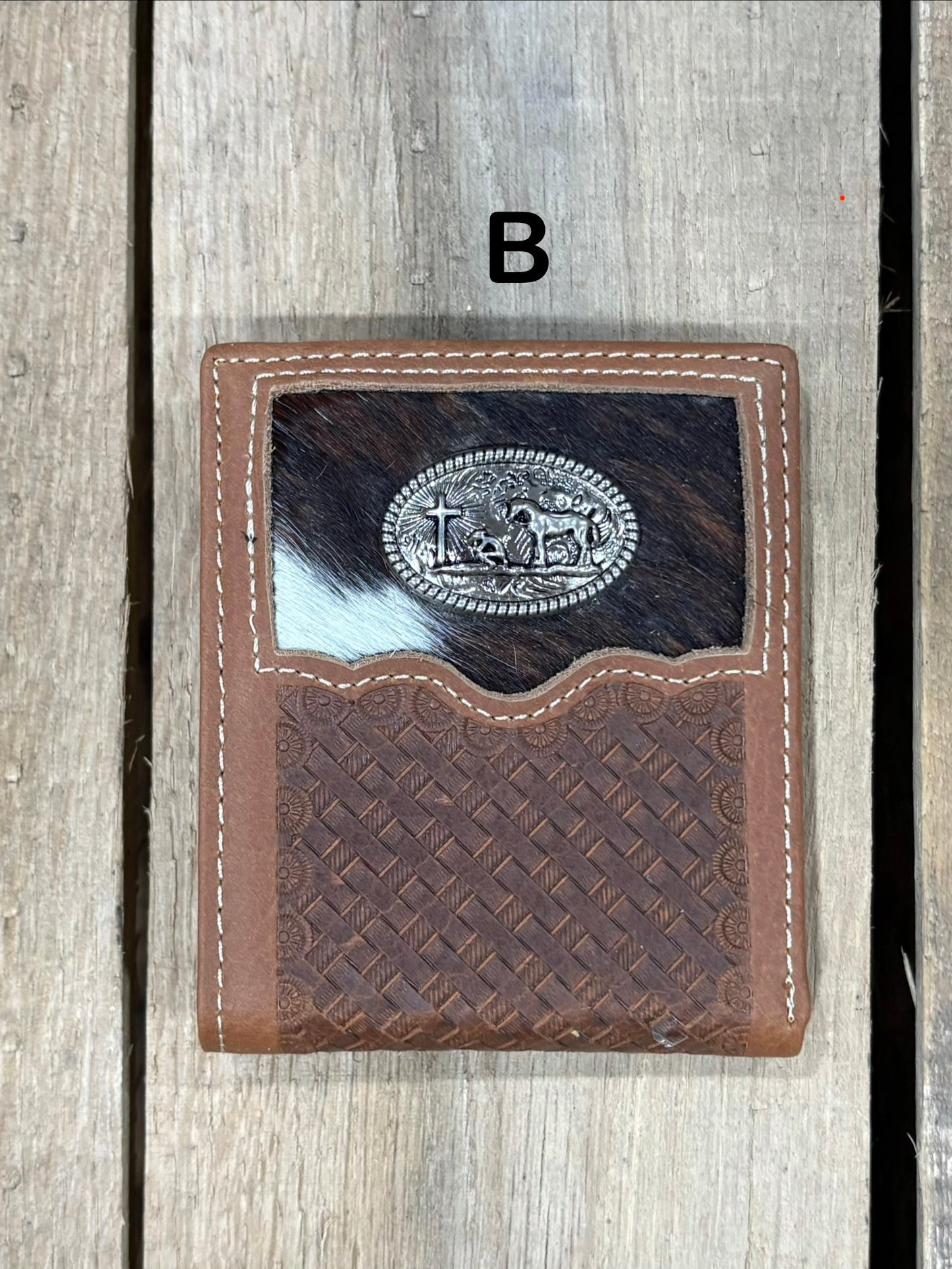 This Brown basketweave leather bifold wallet features a cowhide inlay with a Praying Cowboy Concho. Front View