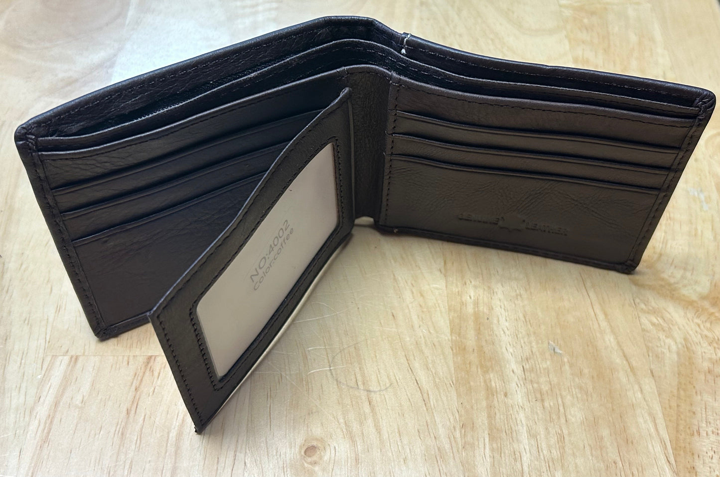 Coffee Brown leather wallet open on a light wooden surface