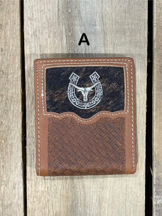 Brown leather wallet with embossed basketweave design and horseshoe and longhorn concho on a wooden surface