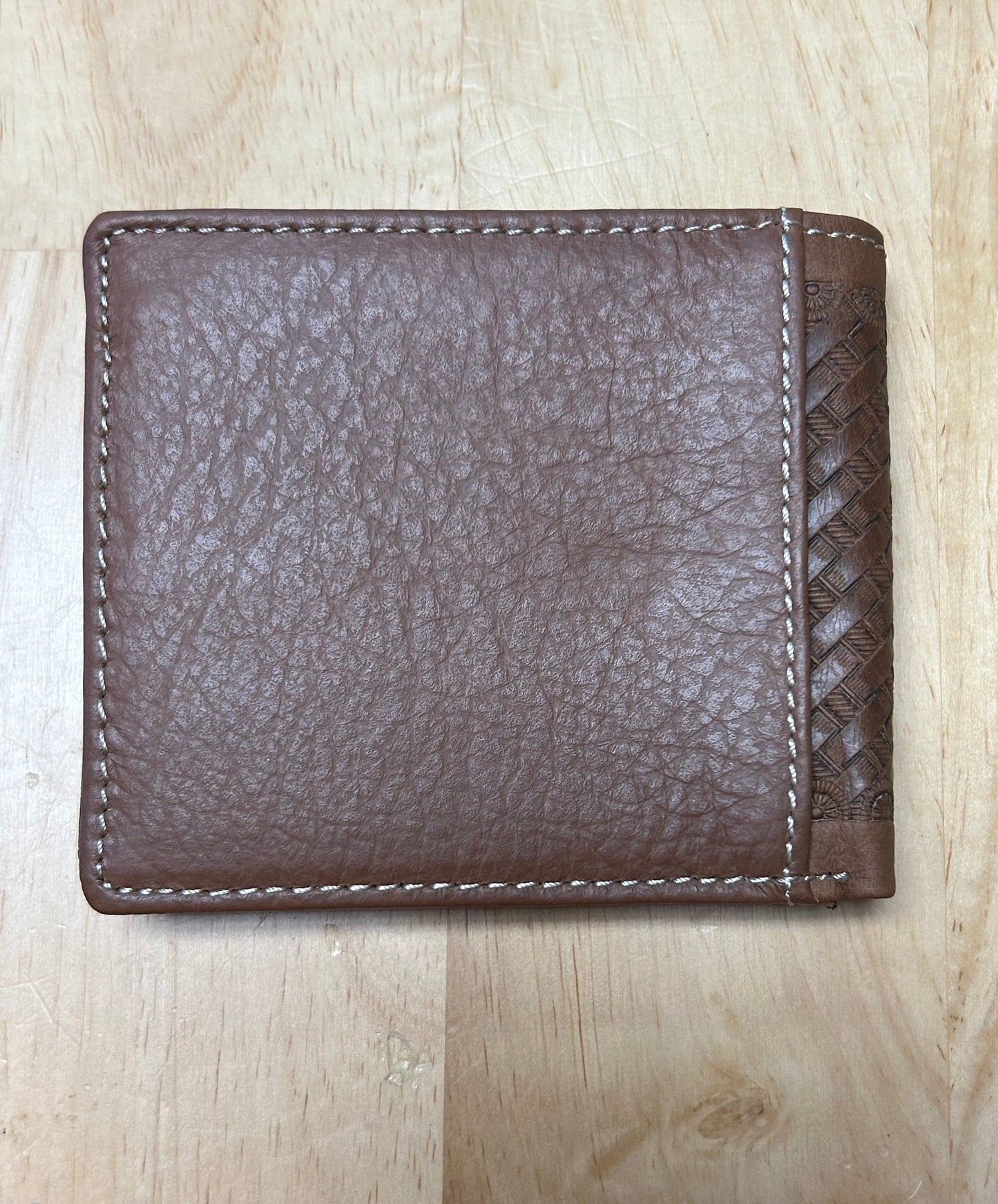 Brown leather wallet on a light wooden surface