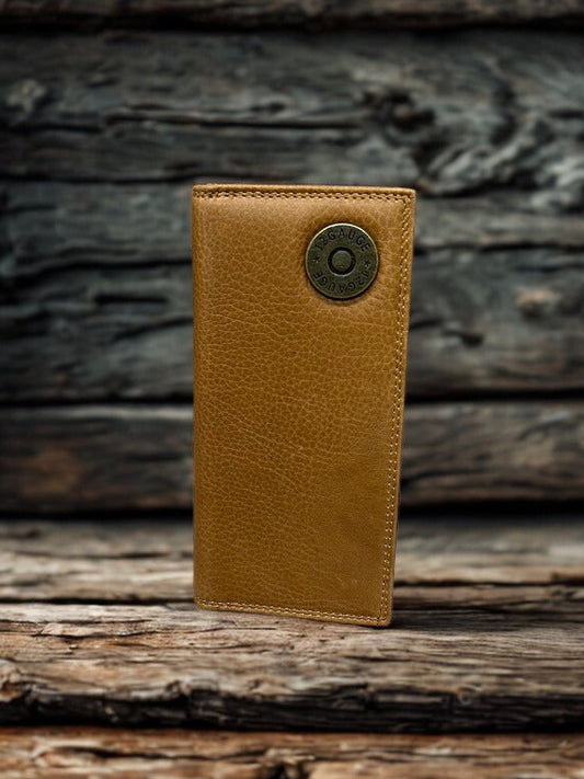 Brown leather wallet with a shotgun shell concho on a wooden surface