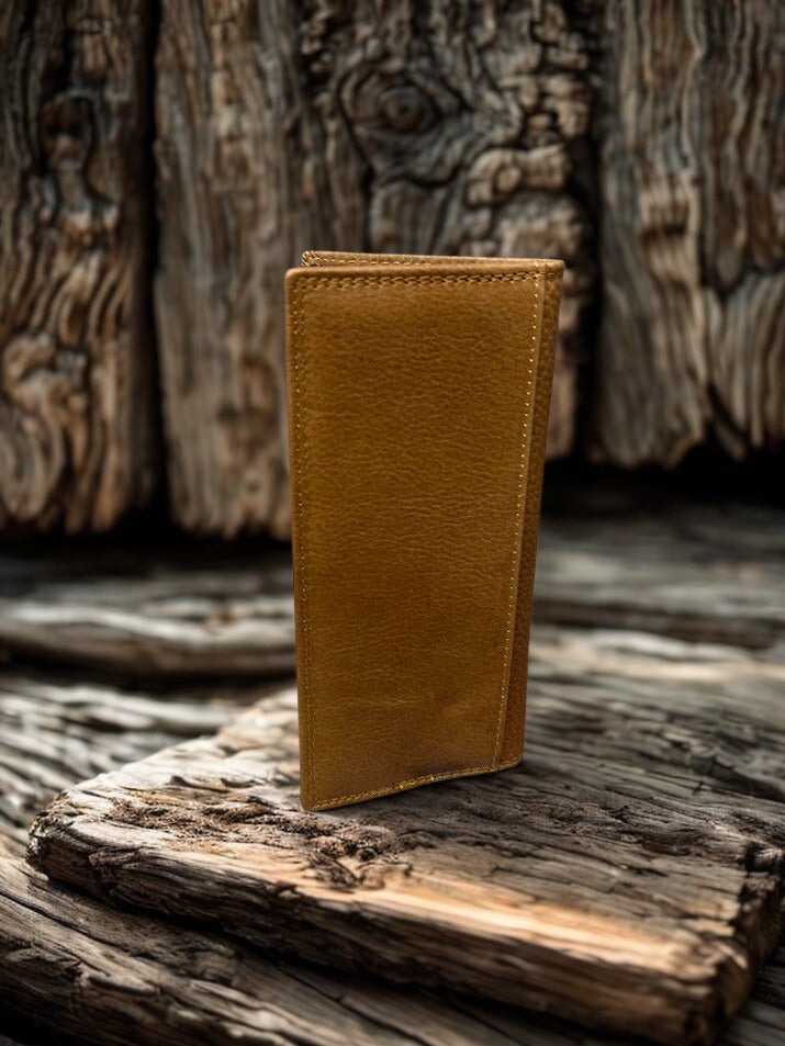 Brown leather wallet on a wooden surface with a rustic background