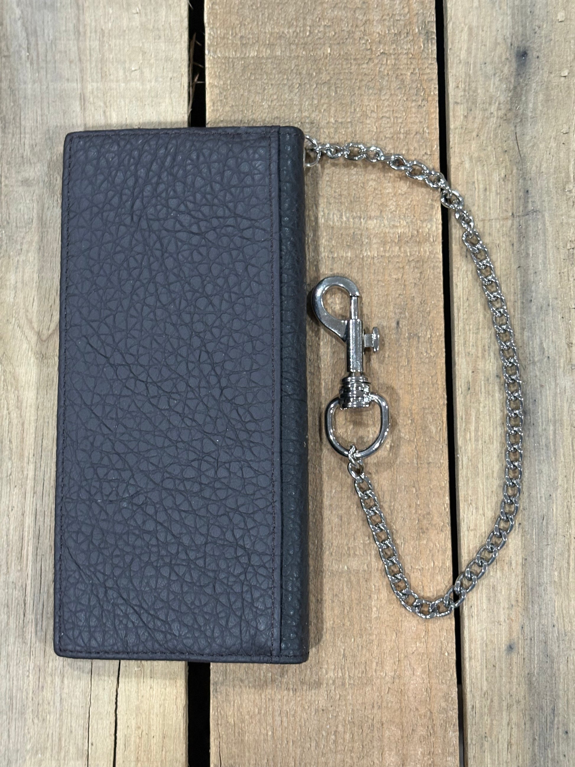 Coffee Brown leather wallet with a chain on a wooden surface