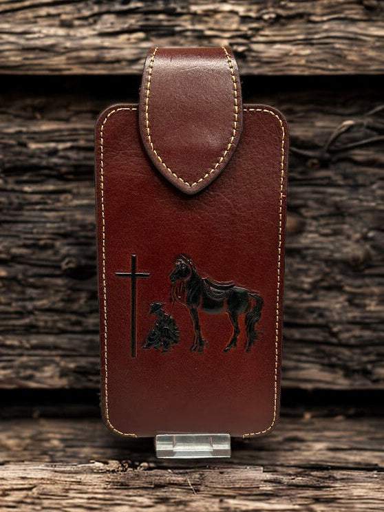 Brown leather phone case with a embossed Praying Cowboy design. Front View