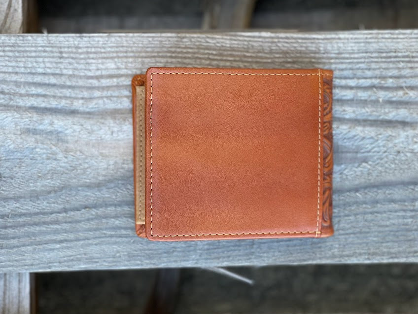 A light brown bifold leather wallet. Rear view showing additional card slot. 